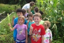 Noelani kids harvesting vegetables at Magoon